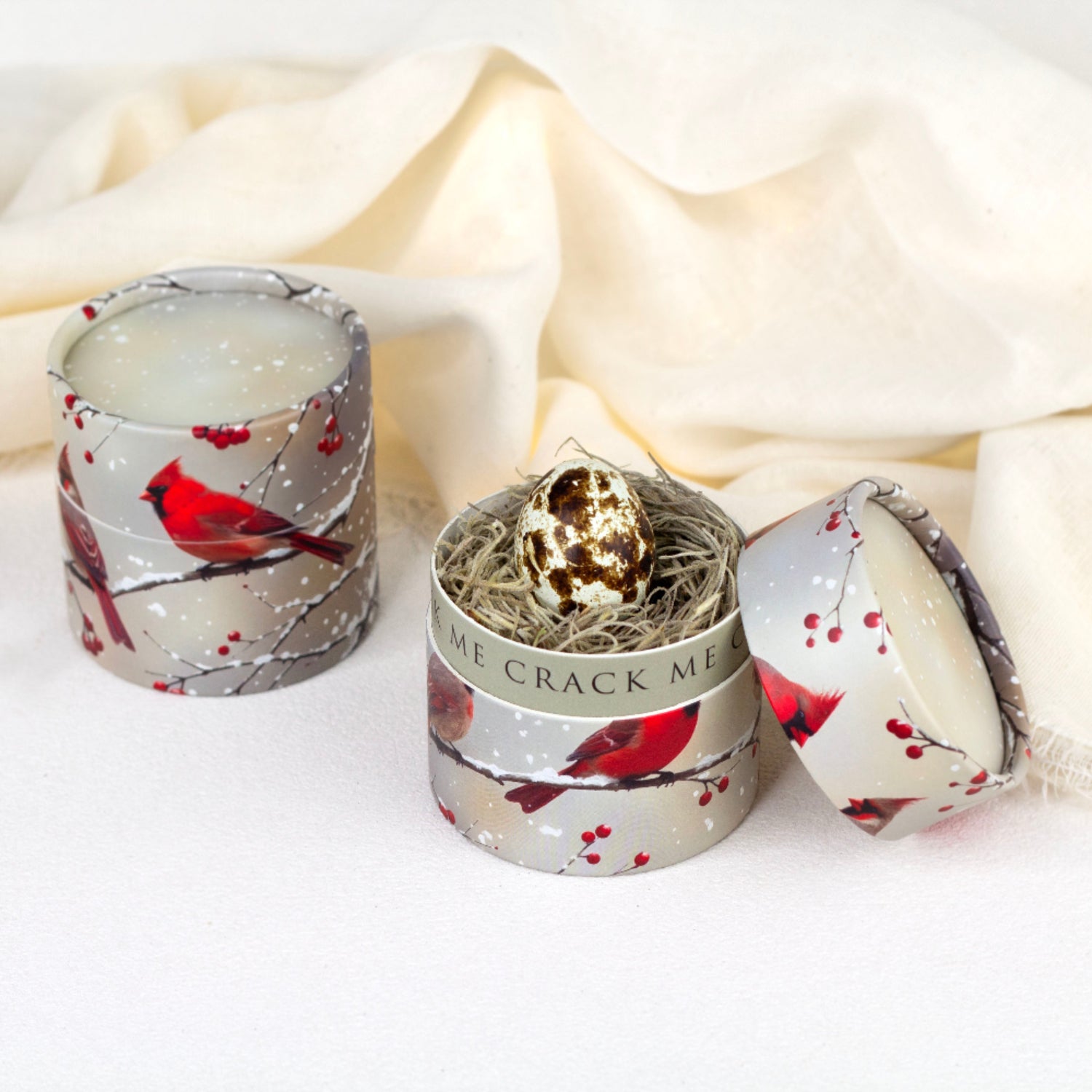 Decorative candles with bird design on a white background